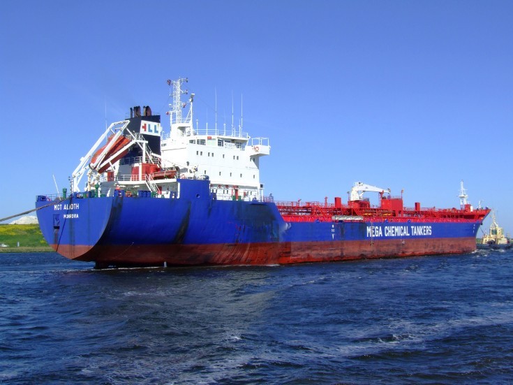 Tanker guided by tugs