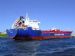 Tanker guided by tugs