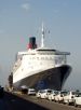 Image of the QE2 and Taxis in Malaga Spain